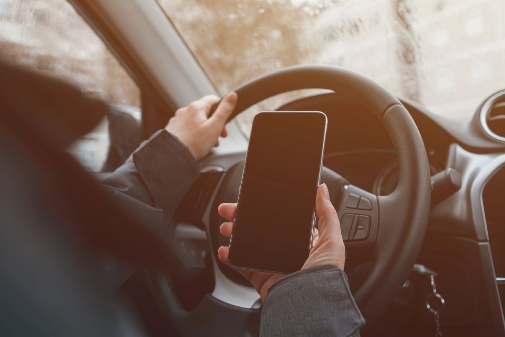 Driver Person Holding Phone While Driving