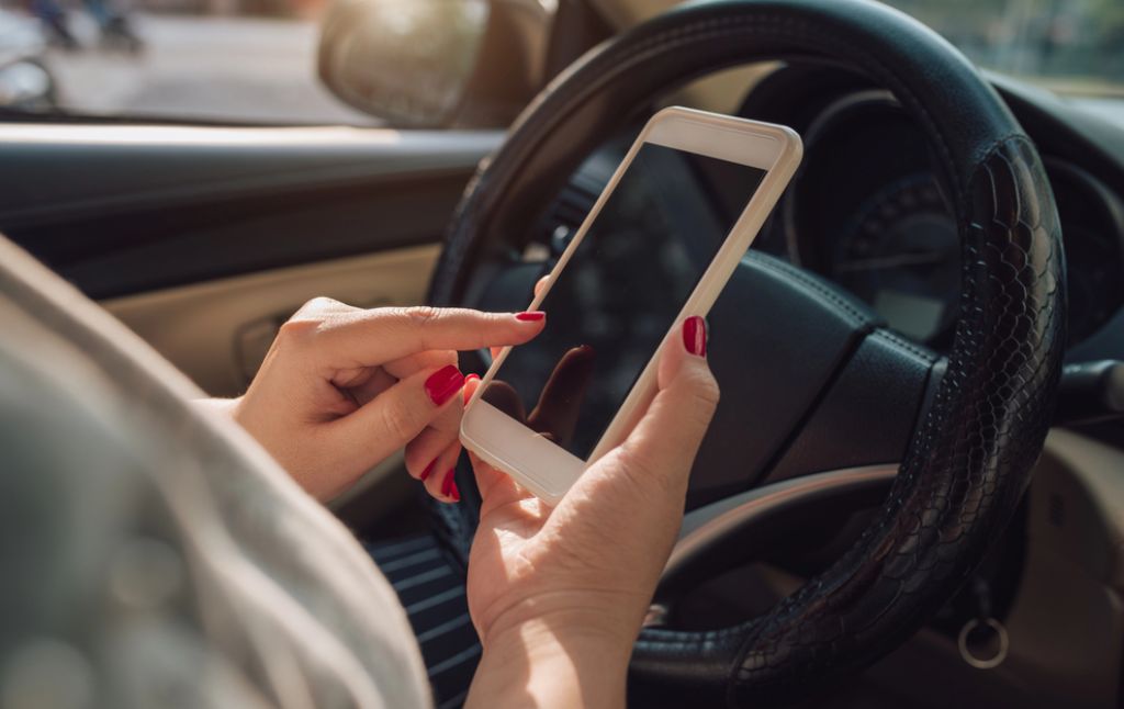 Driver Holding Phone Person Holding A Phone While Driving