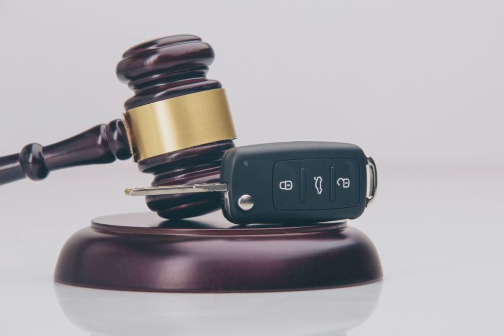 Law Attorney Meeting with Client at Desk Two people discussing legal documents at a lawyer's office with justice scale and gavel on the table