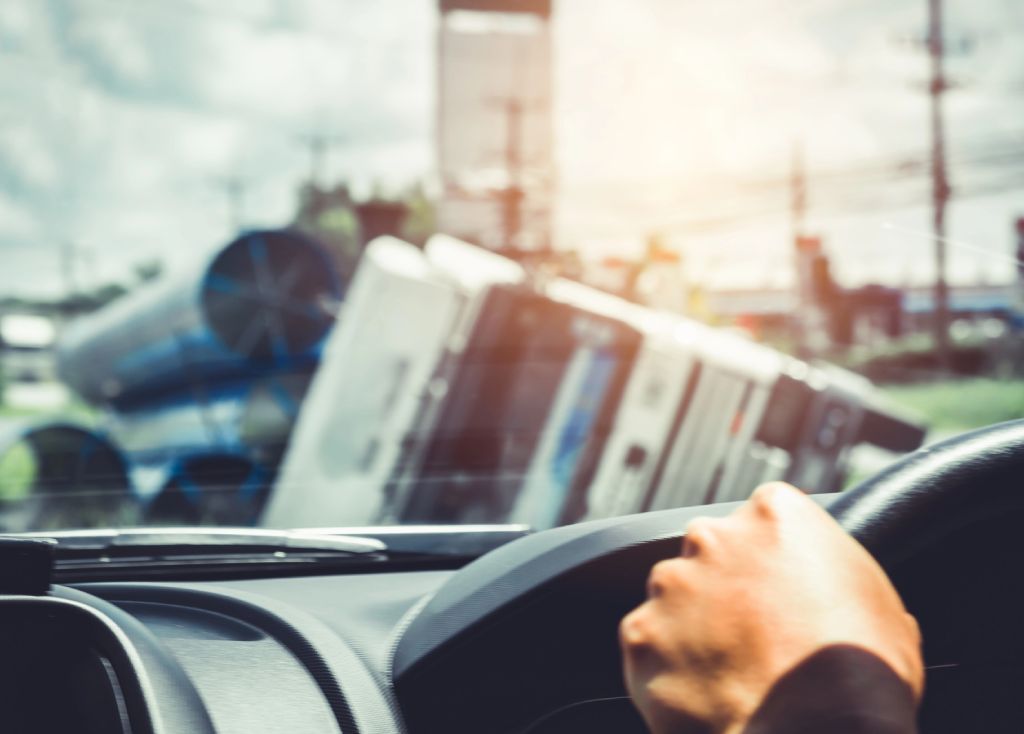 The large truck is in a side ditch after the accident