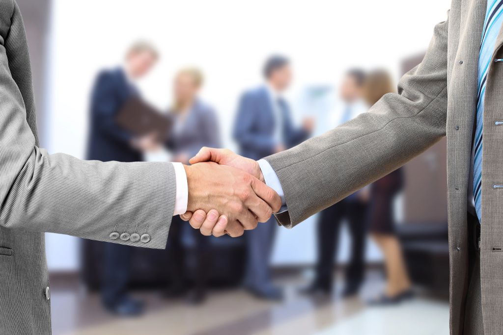 Businessmen shake hands Businessmen shake hands after reaching a successful deal